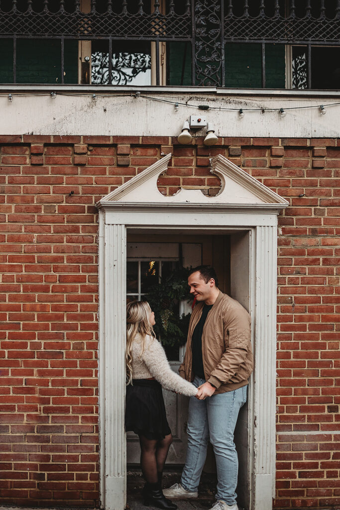 Baltimore photographer captures couple looking at one another in doorframe