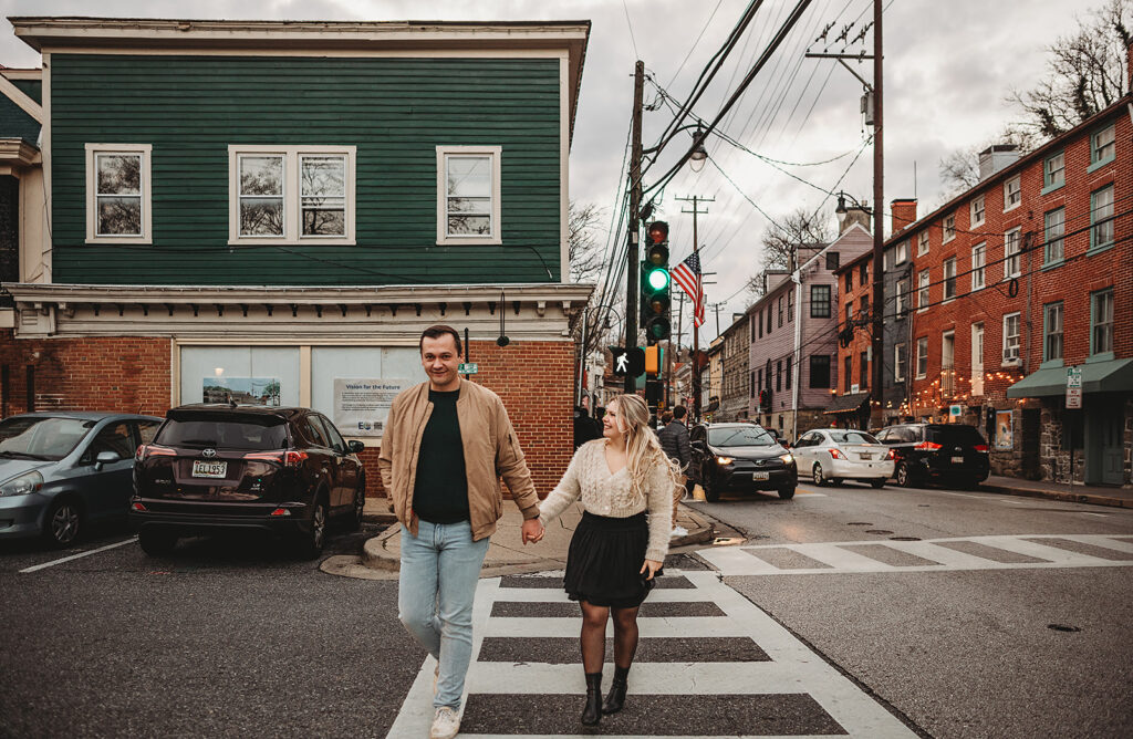Baltimore Photographer captures couple walking hand in hand across crosswalk in Ellicott City
