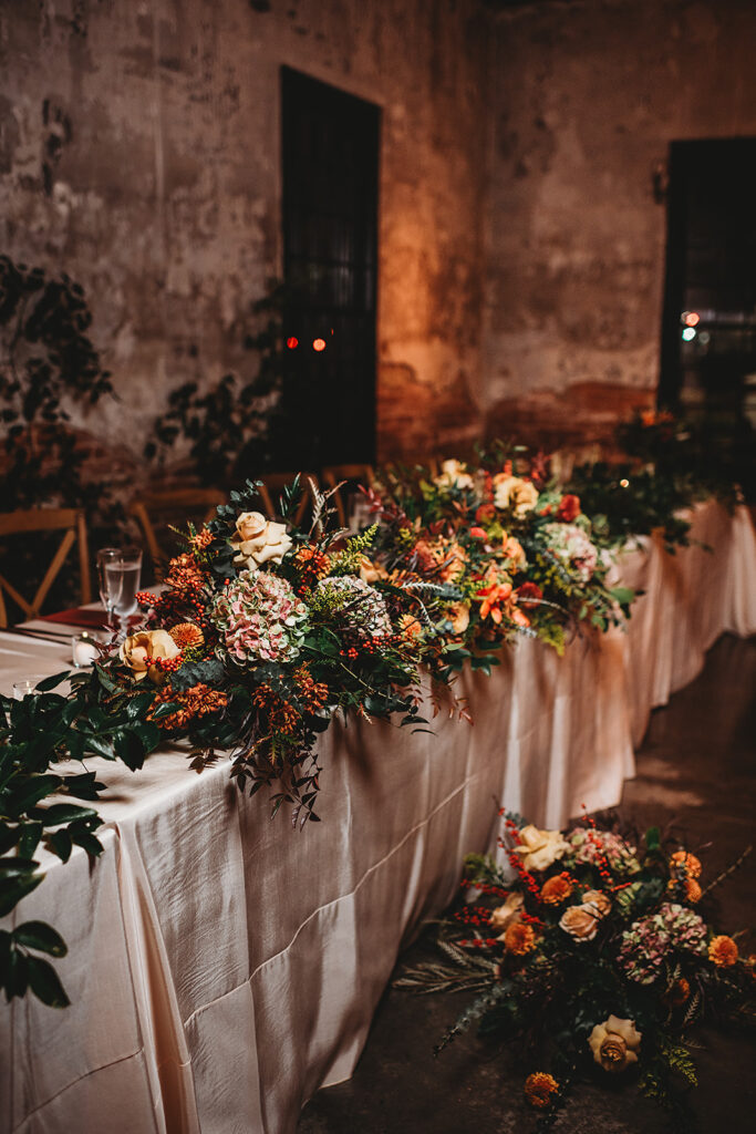 Baltimore wedding photographer captures wedding table with flowers all over
