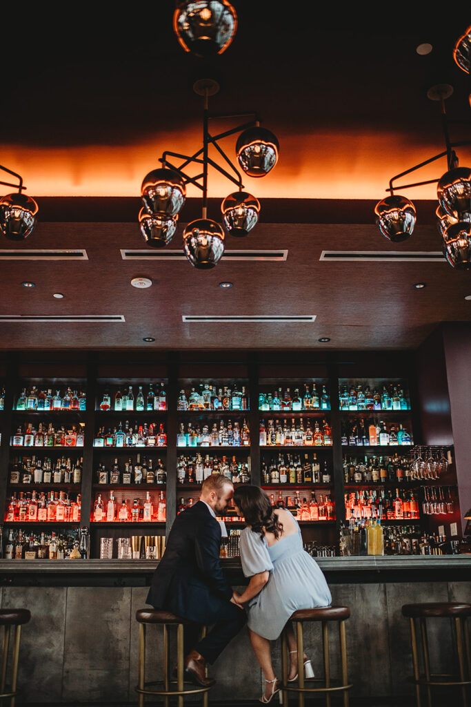 Baltimore Wedding Photographer captures man and woman sitting at bar