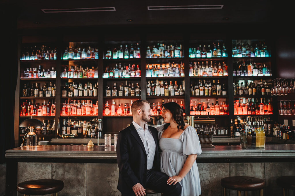Baltimore Wedding Photographer captures man and woman embracing at bar
